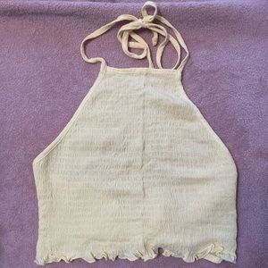 Super cute light yellow halter top w/ adjustable straps. Never worn